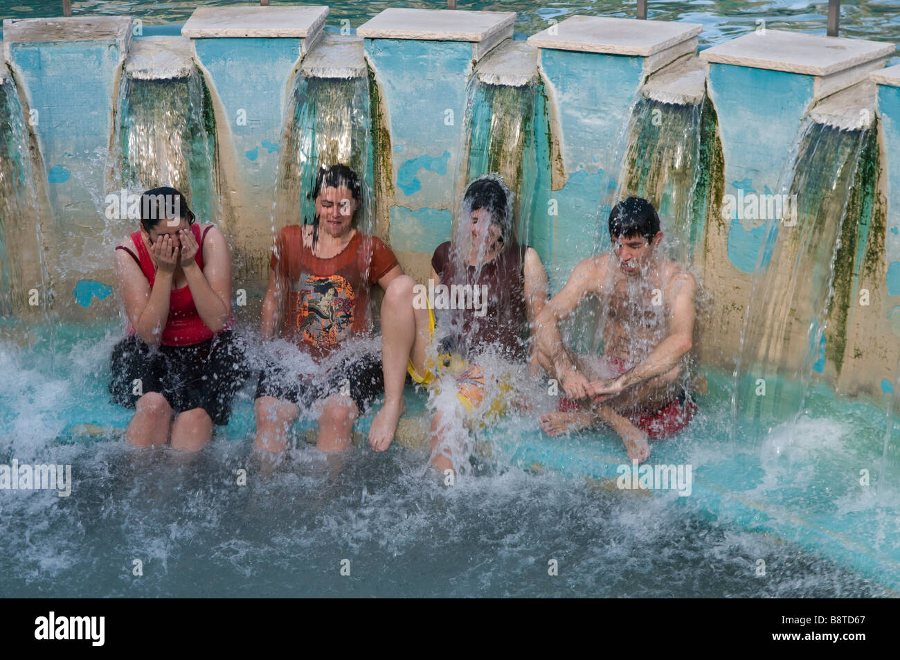 Members of the Druze community bath at Hamat Gader or al-Hamma a hot springs site in the Yarmouk River valley in Golan Heights Israel Stock Photo