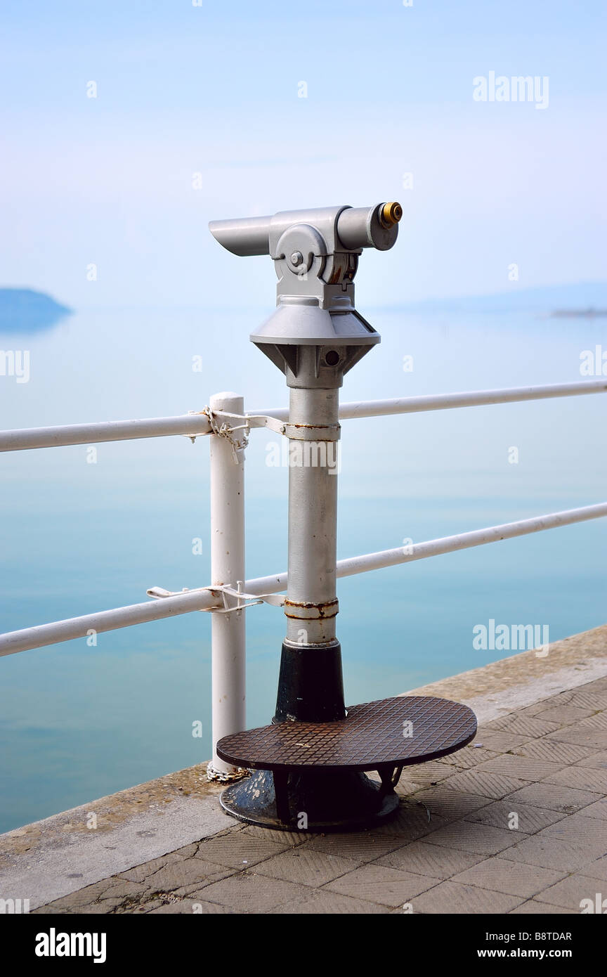 Old turistic telescope by the lakeside Stock Photo