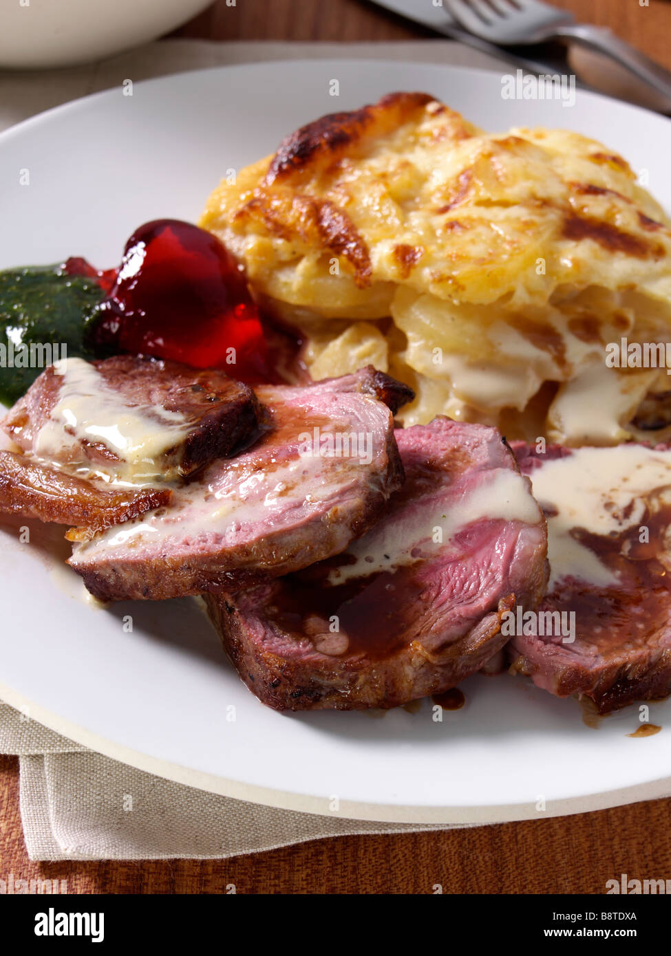 Lamb rump with dauphinoise potatoes Stock Photo Alamy