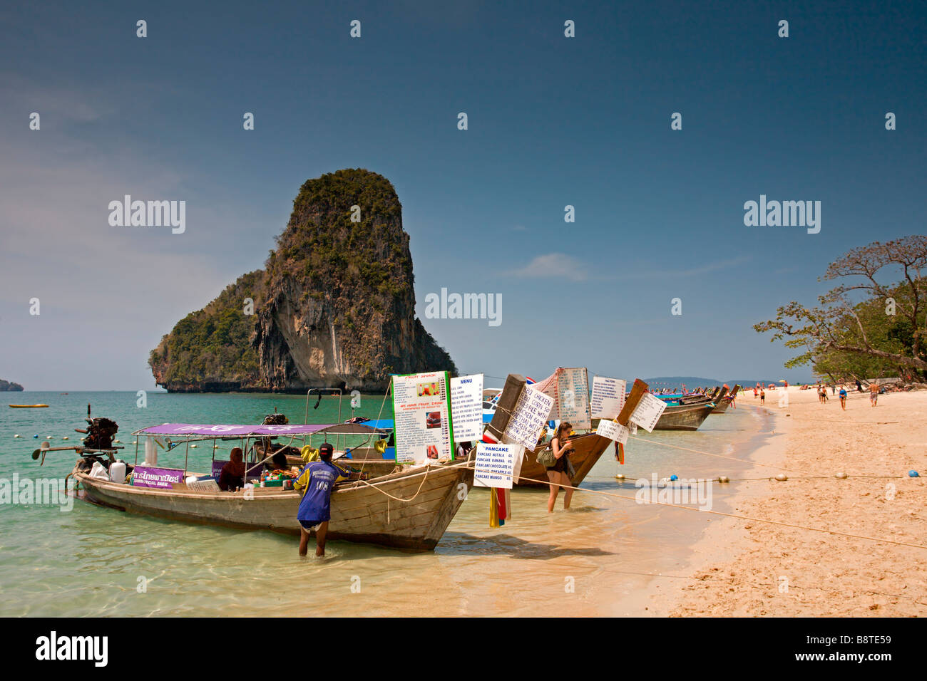 Phra Nang Beach: Long-Tail Boats with Rock Stock Photo