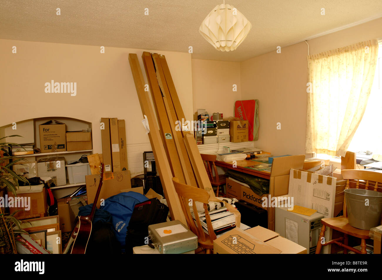 store room filled with boxes and files from a previous house. Stored