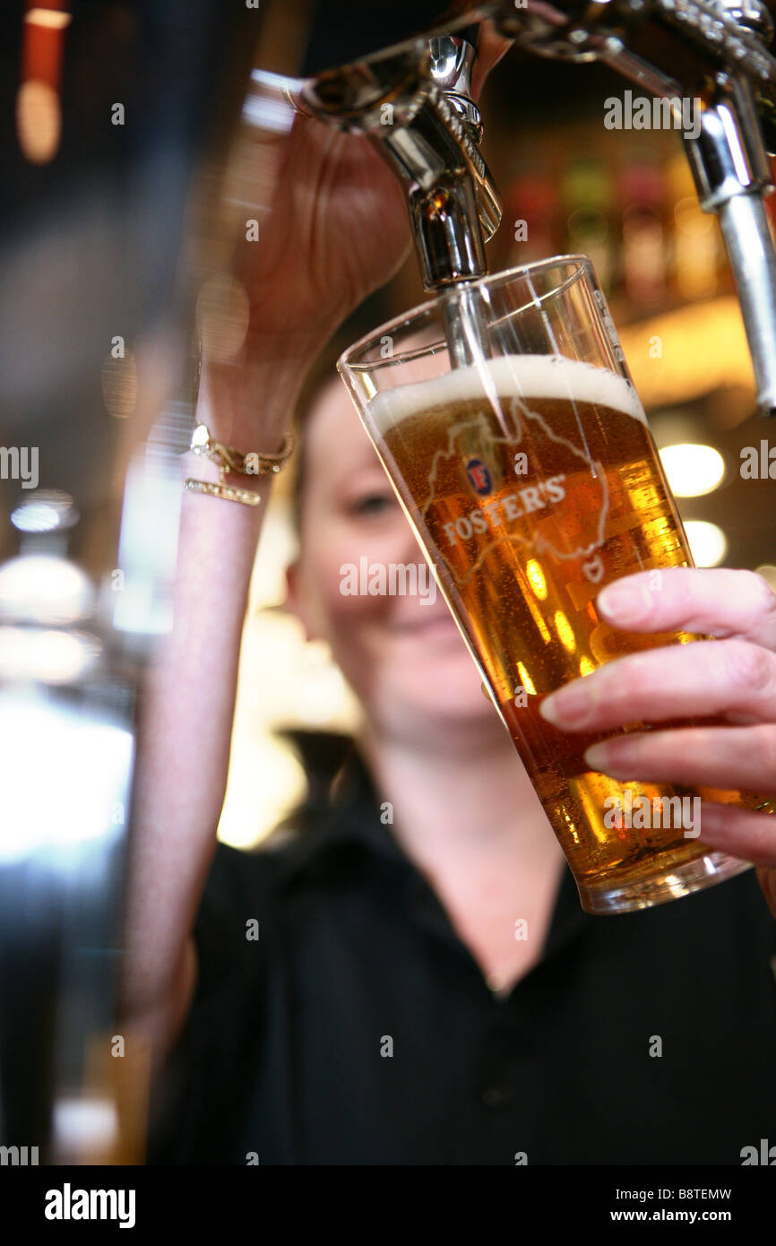 Bar waitress serving with alcoholic drinks Stock Photo - Alamy