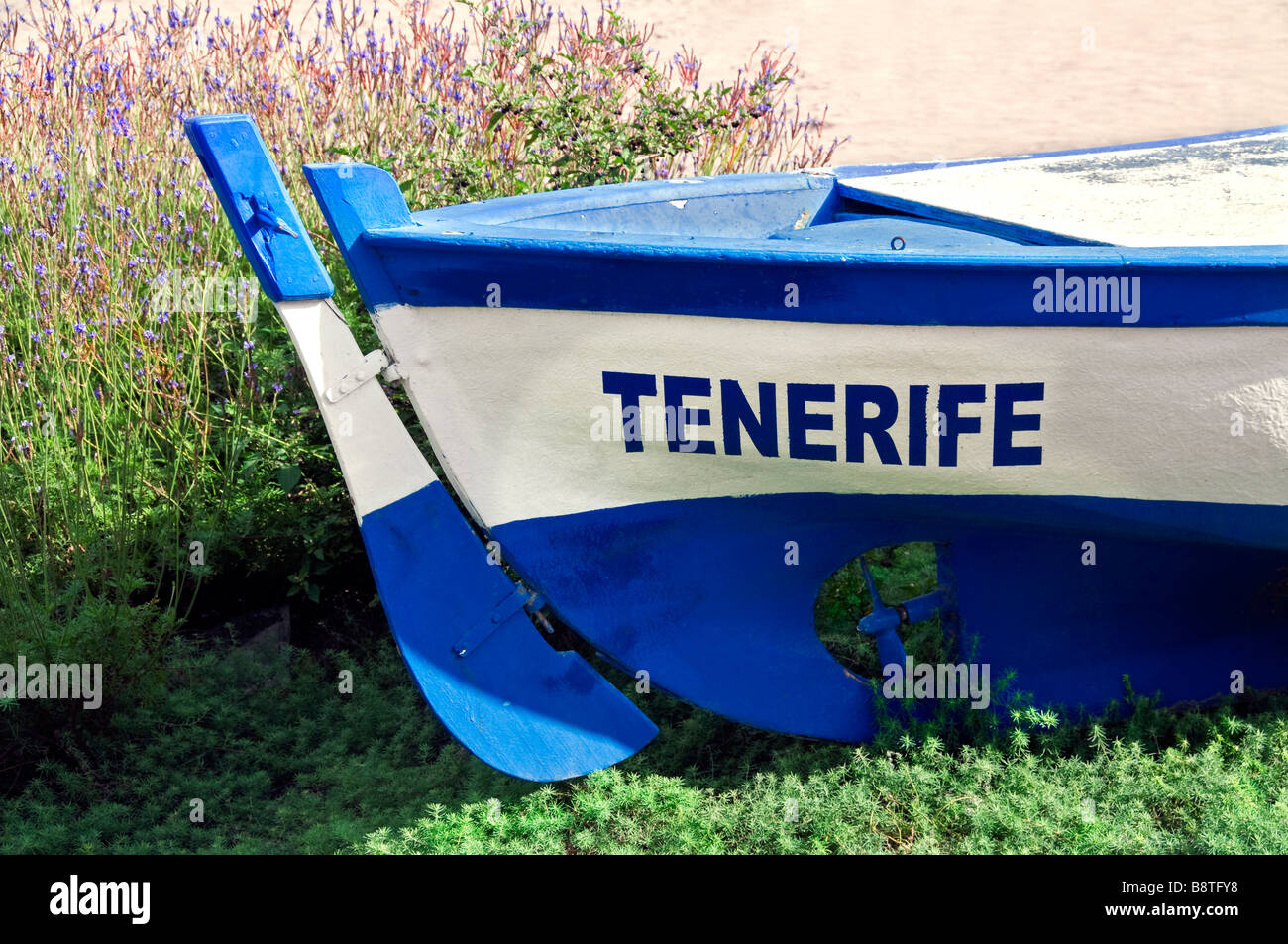Feature traditional wooden fishing boat named 'Tenerife' lying on Los Cristianos beach Tenerife Canary Islands Spain Stock Photo