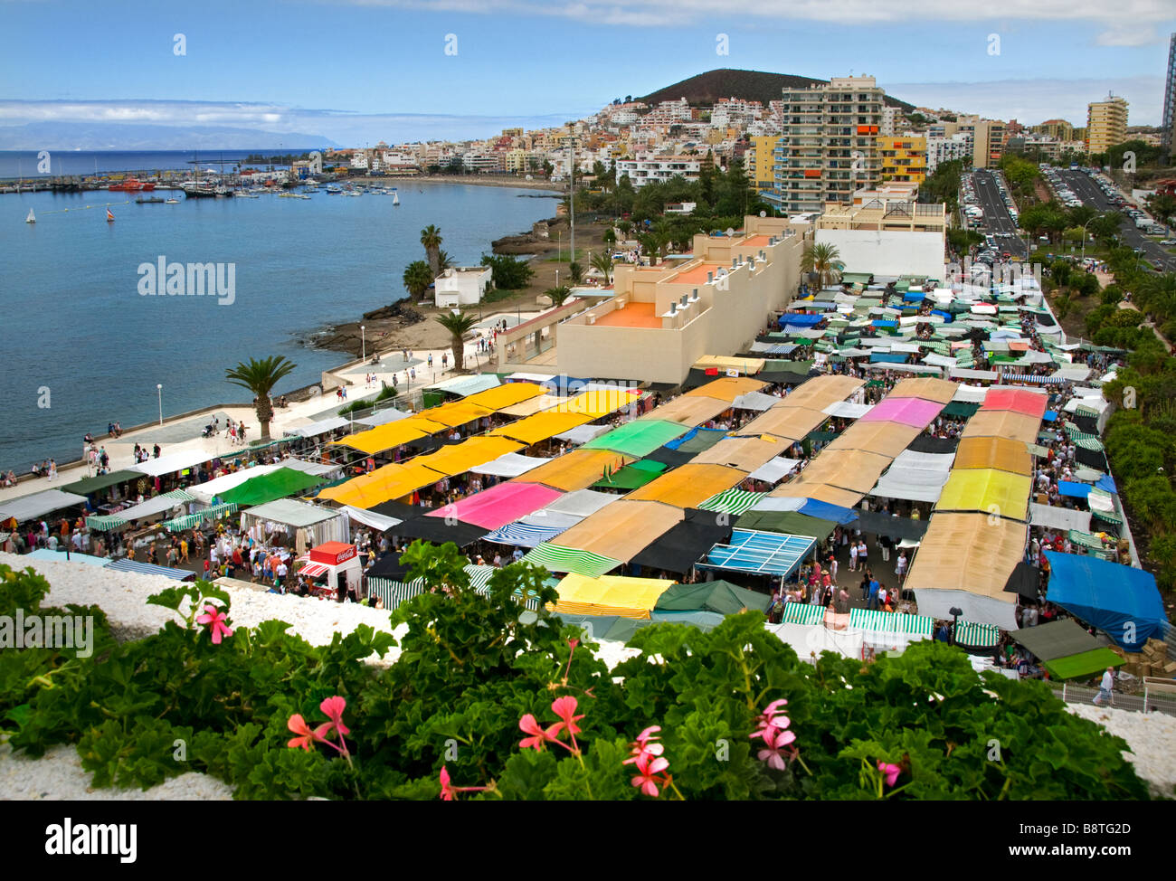 LOS CRISTIANOS MARKET High overview of the colourful busy market stalls at the popular Sunday market in Los Cristianos Tenerife Canary Islands Spain Stock Photo