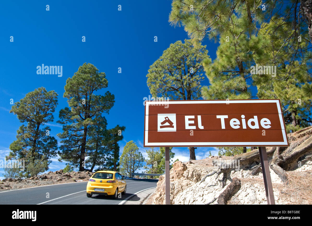 Tourist hire car on the spectacular drive up the slopes of Teide National Park, El Teide, Southern Tenerife Canary Islands Spain Stock Photo