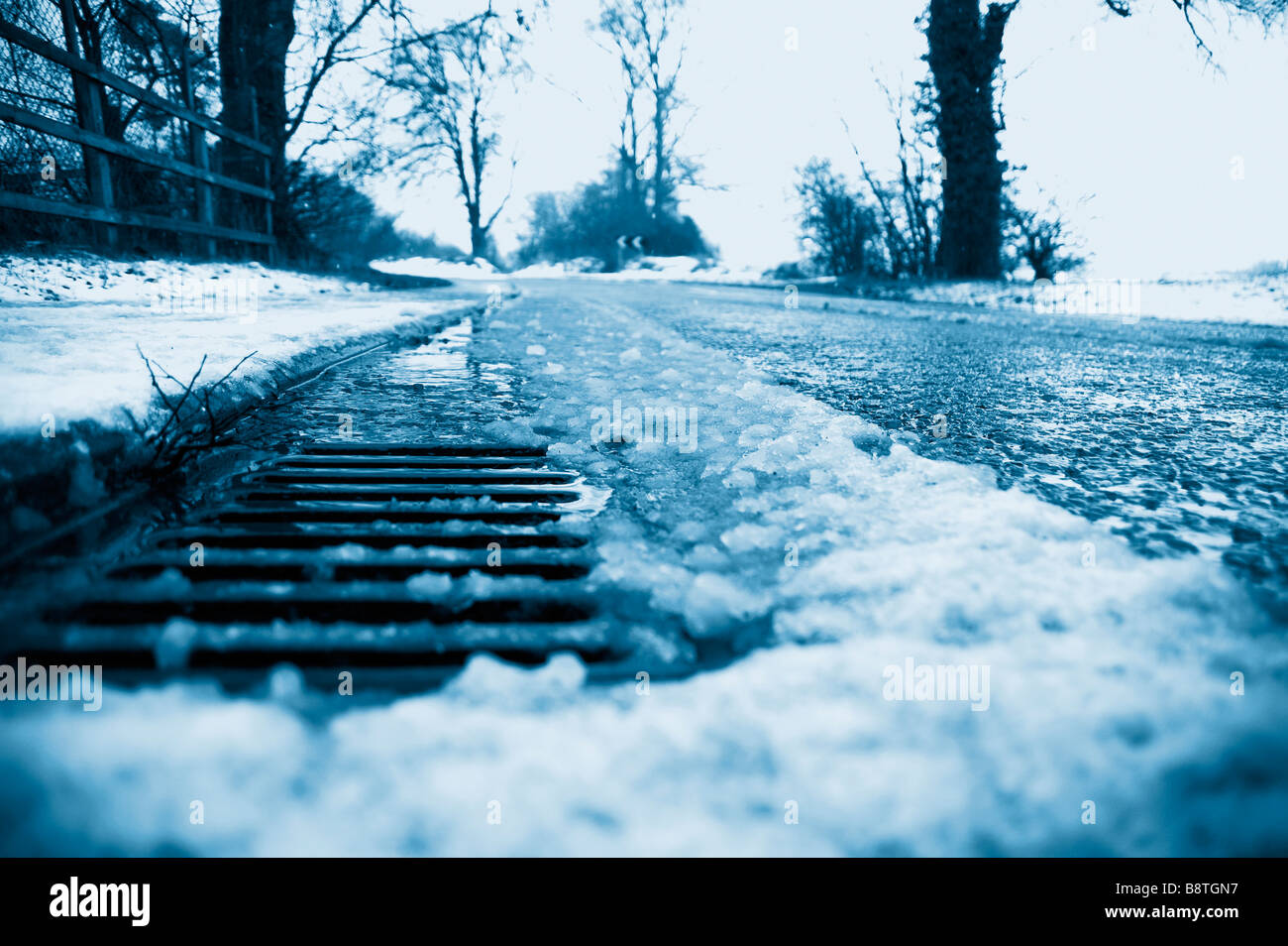 A roadside drain with melting snow Stock Photo Alamy