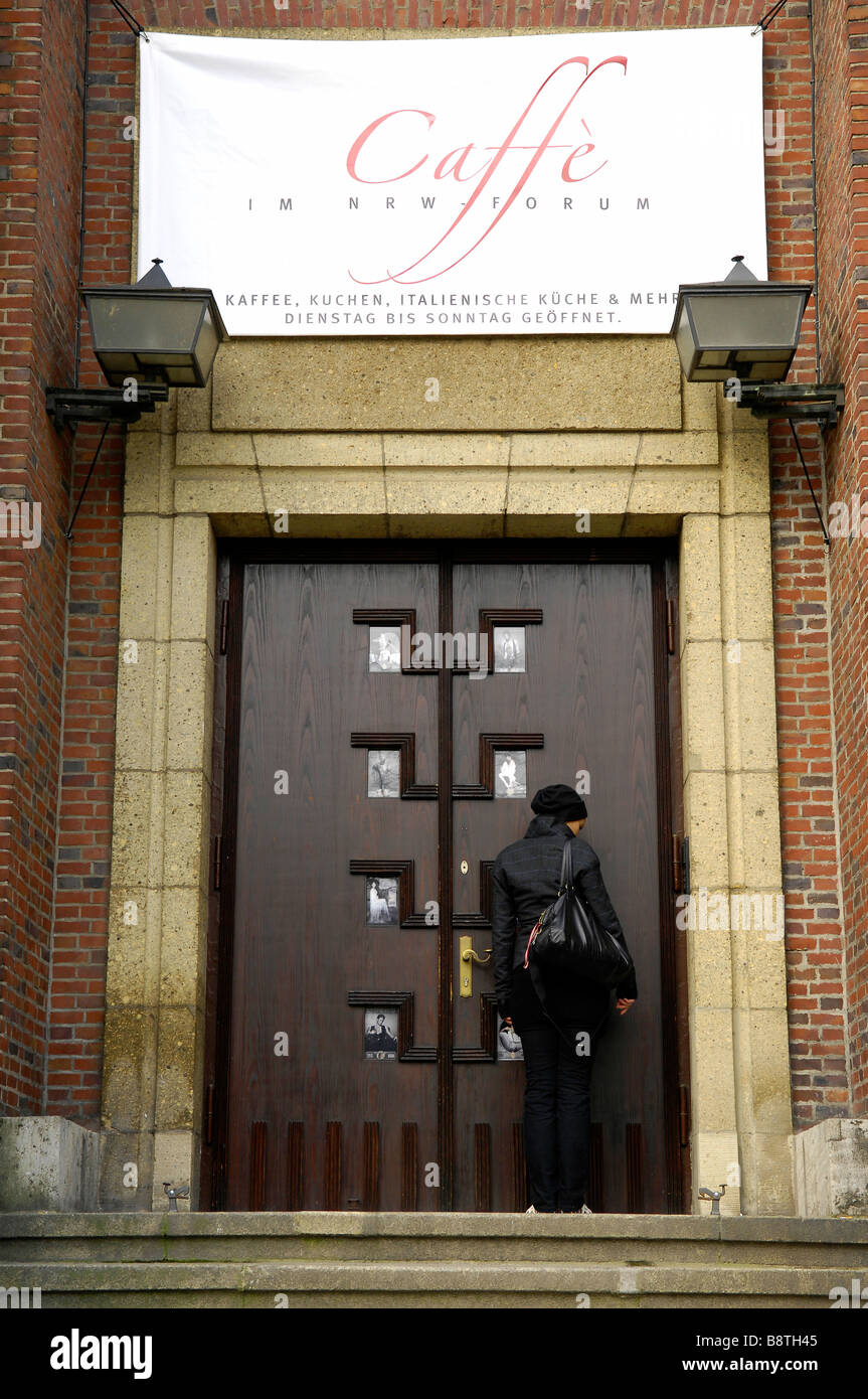 young woman in doorway Stock Photo - Alamy