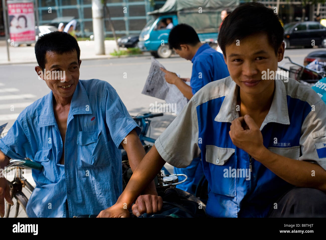 Plumbers waiting for clients on their bicycles in Wuhan city, Hubei province, China. Stock Photo