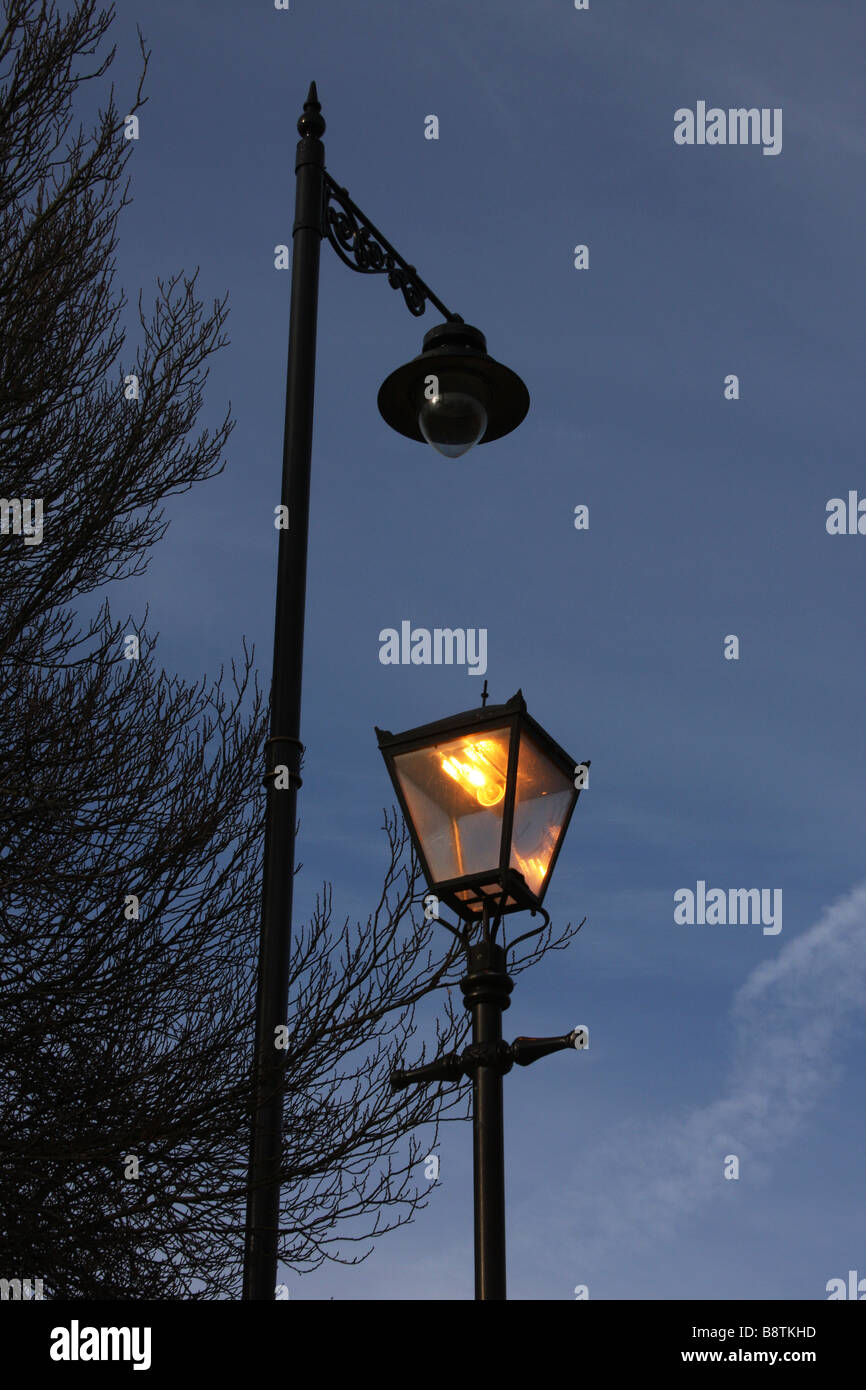 Old and new street lighting. Stock Photo