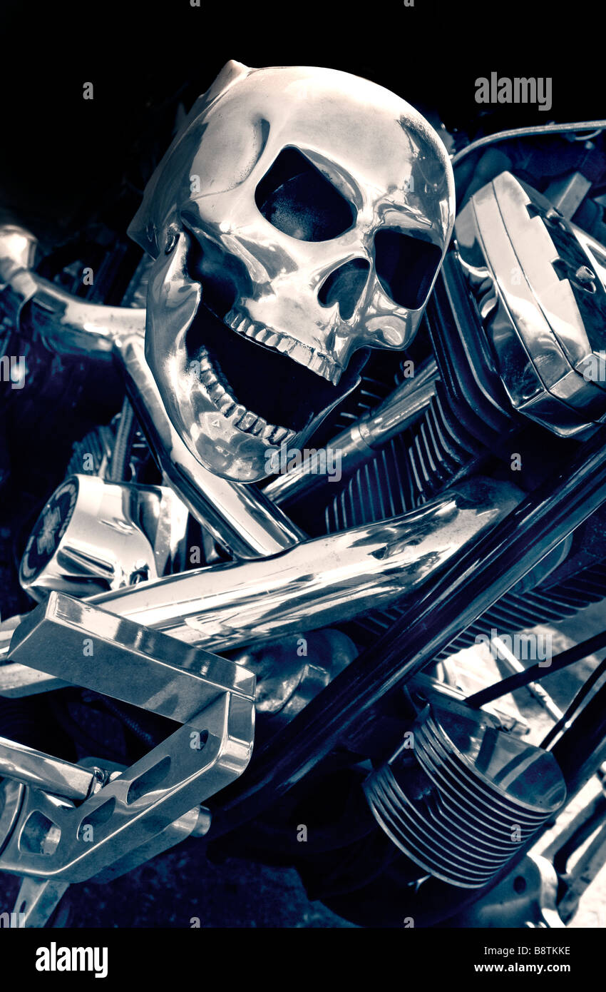 Metal human skull motorbike accessory attached to the polished chrome on a Harley-Davidson Motorcycle engine Stock Photo