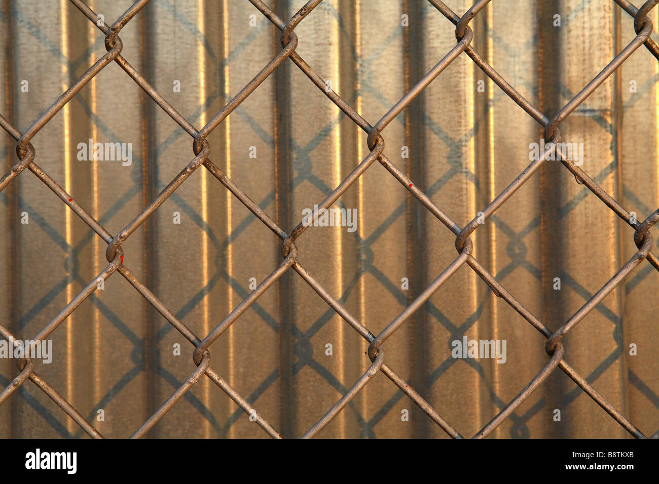 Fence and Corrugated Steel Barrier Stock Photo