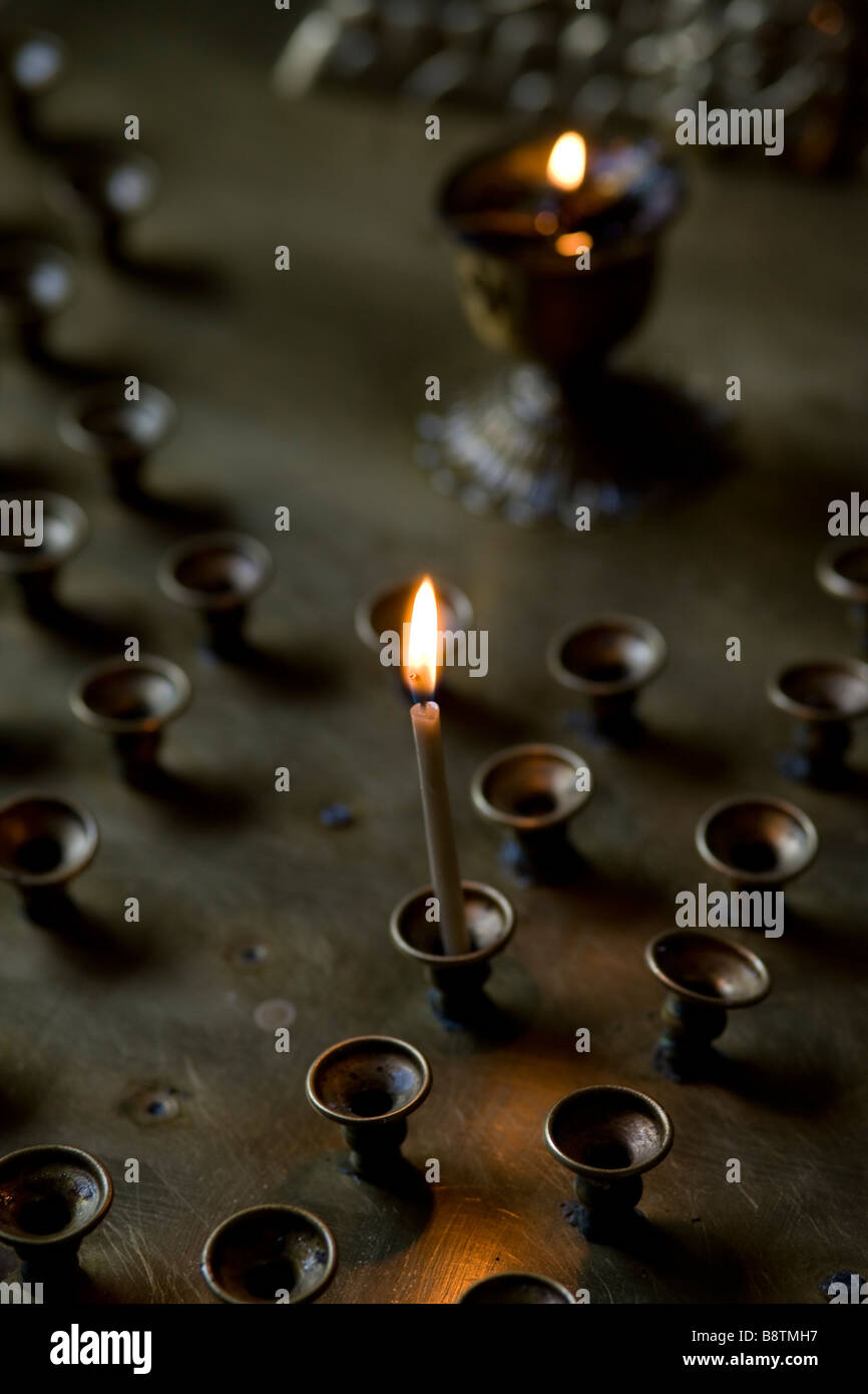 Burning votive candle on Altar. Shallow focus. Russian Orthodox church