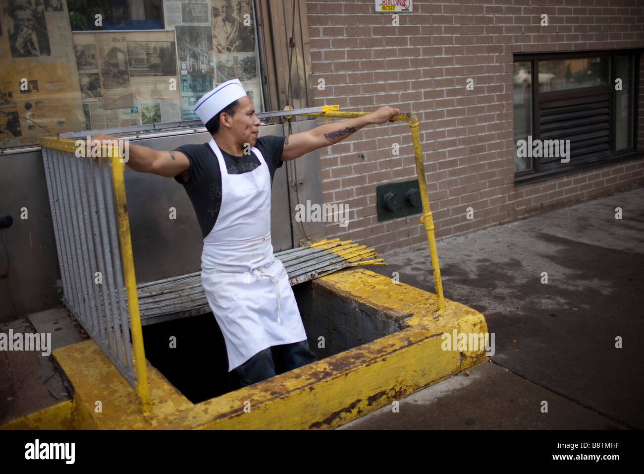 Busboy takes a breather - Stock Image