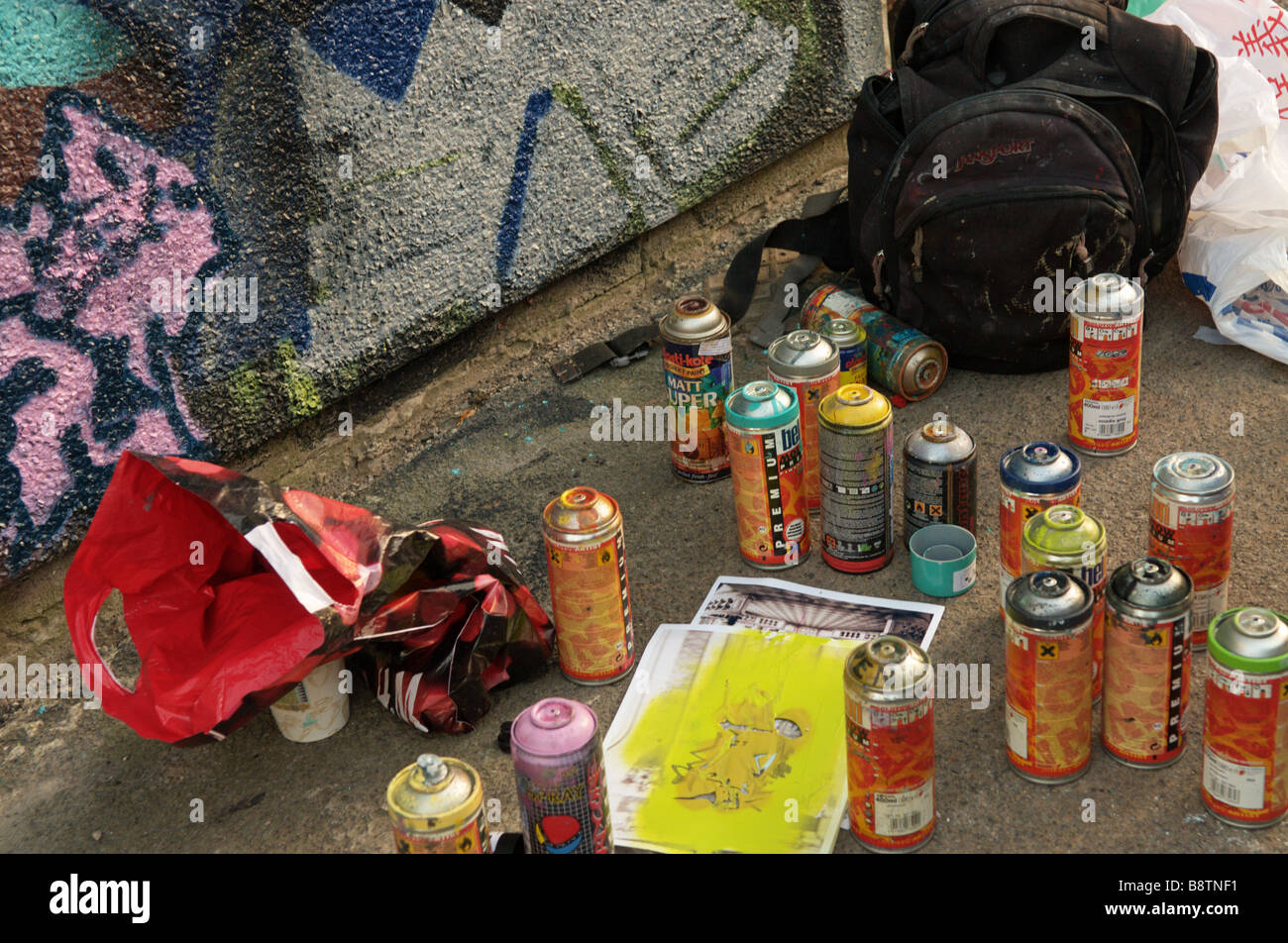 Spray paint cans used in painting graffiti and wall murals Stock Photo