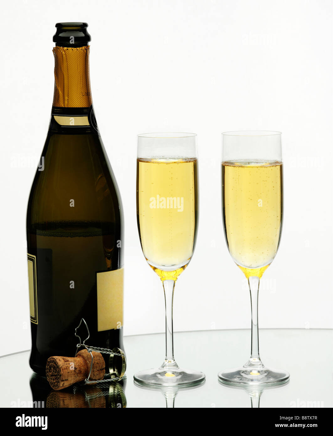 Two glasses of champagne on isolated white background Stock Photo - Alamy