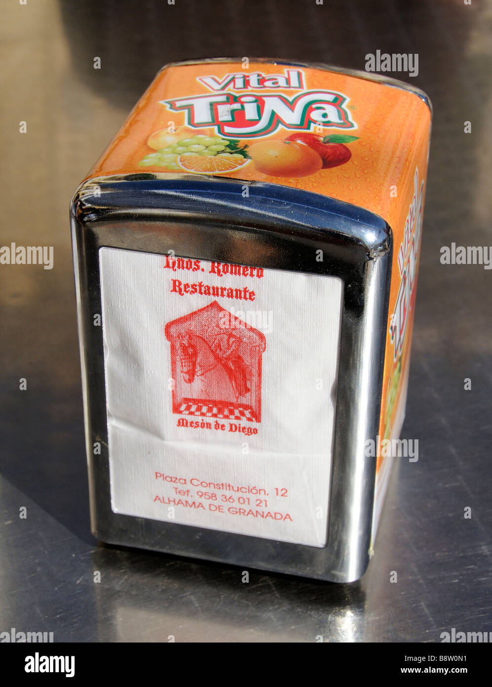 serviette dispenser napkin help yourself container box seen in a Spanish cafe restaurant Stock Photo