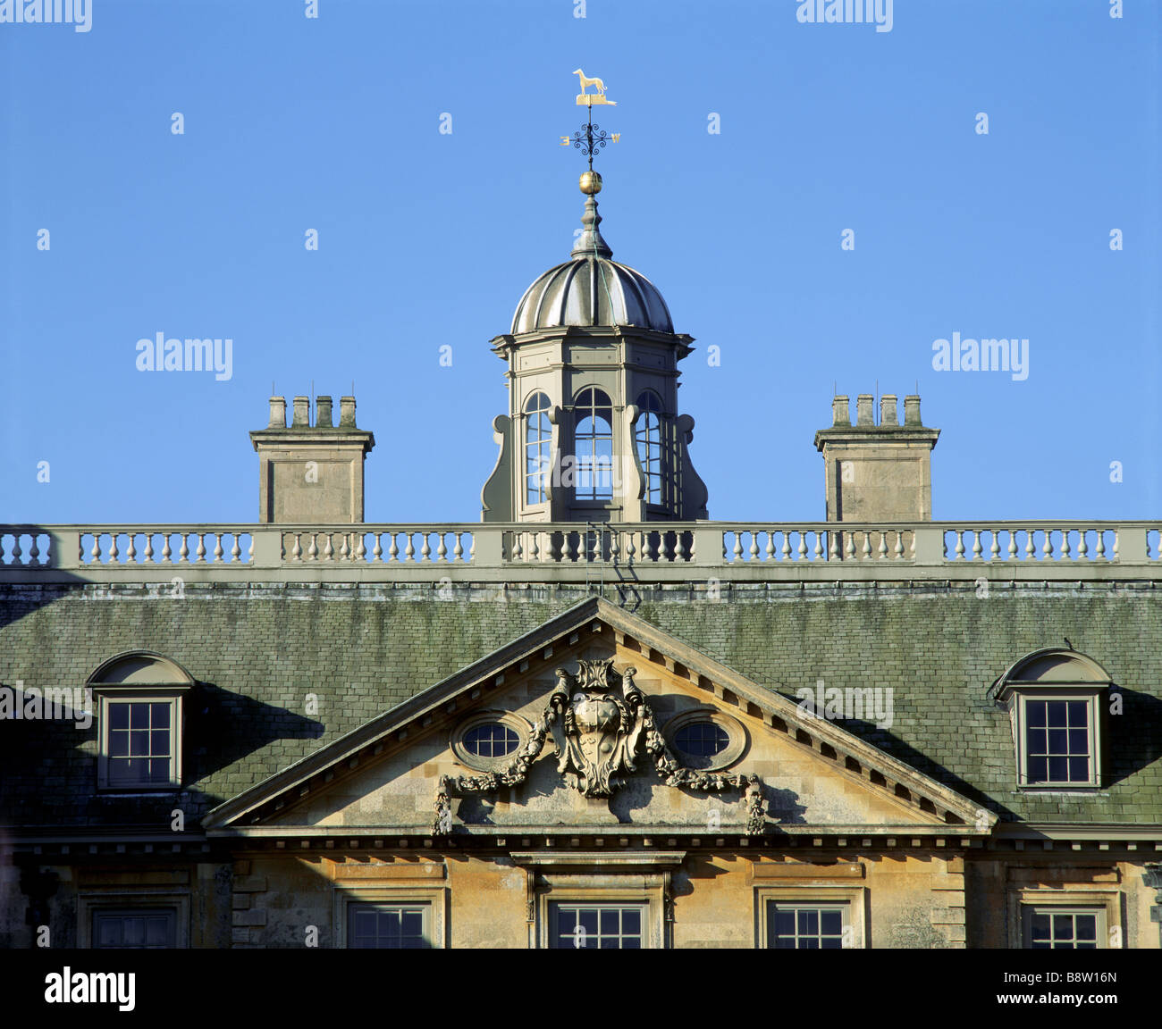 A close view of part of the North front of Belton House showing coat of arms and the cupola Stock Photo