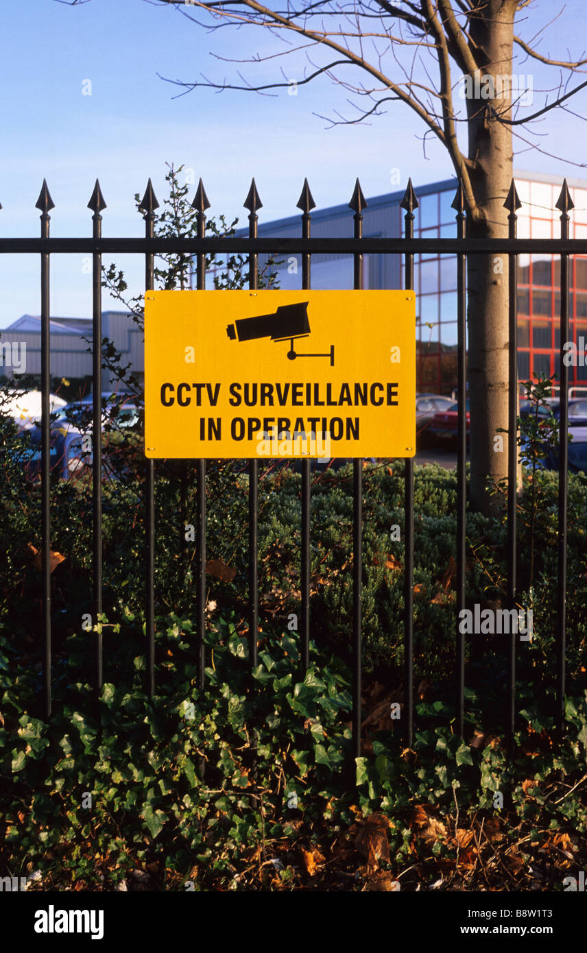 warning sign of close circuit television cameras at business premises on industrial estate UK Stock Photo