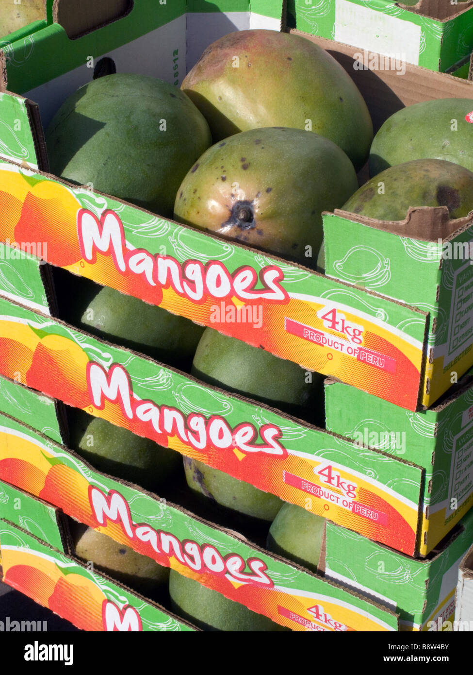 UK.Fruit boxes with mangoes from Pakistan at Whitechapel market,London