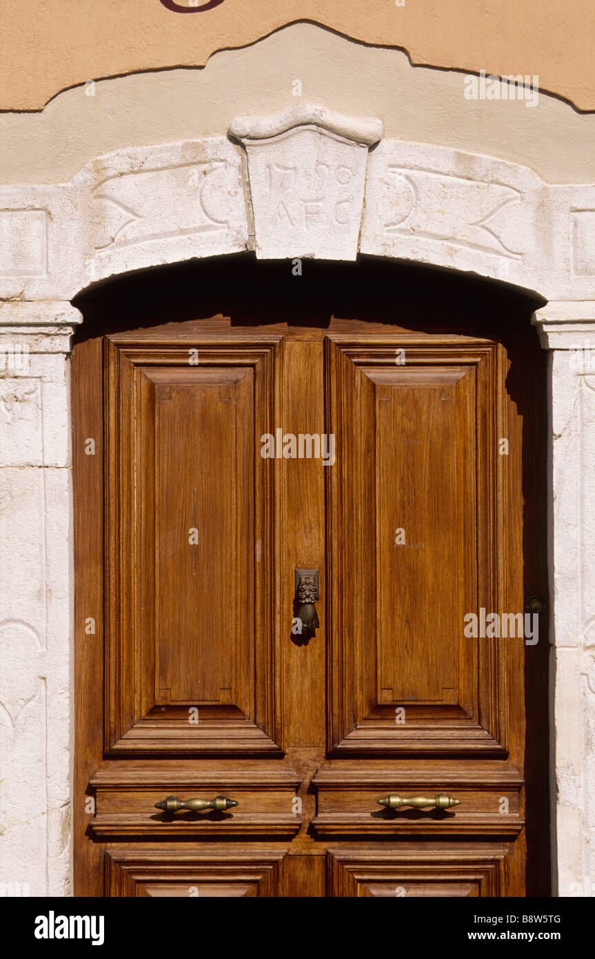 Renovated wooden door in a mediterranean village Stock Photo