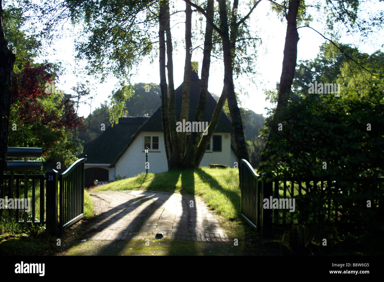 landscape with trees and house Stock Photo - Alamy