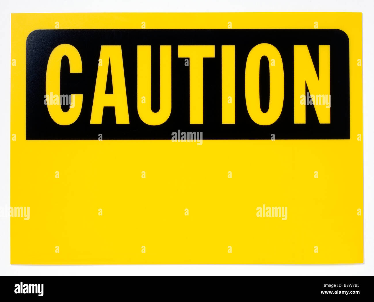 Yellow and black Caution sign Stock Photo