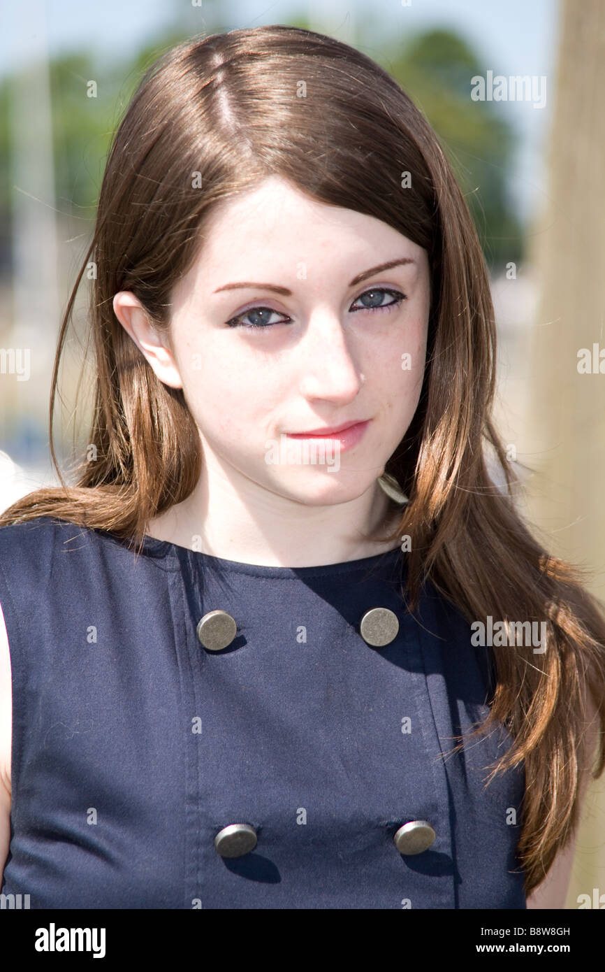 Pretty young girl enjoying the summer sun in the harbour of Caernarfon