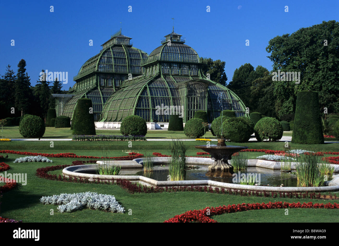 Glass & Steel Palm House, Palmenhaus or Greenhouse in the Schloss Schönbrunn Palace Gardens & Pool, Vienna, Austria Stock Photo