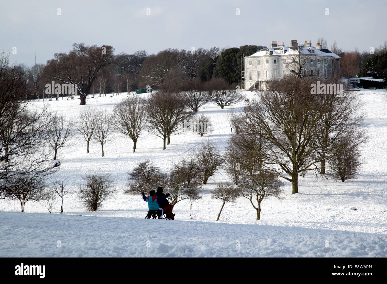 Shot of people tobogganing down the golf course in Beckenham Place Park