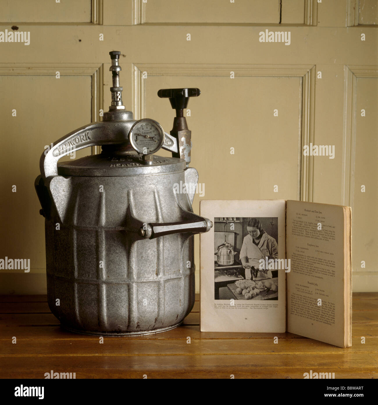 Close up of a pressure cooker with instruction book in the kitchen at Baddesley Clinton Stock Photo