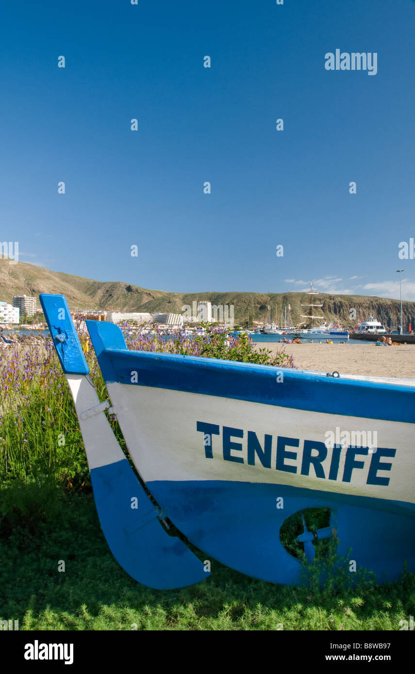 Feature traditional wooden fishing boat named 'Tenerife' lying on Los Cristianos beach Tenerife Canary Islands Spain Stock Photo