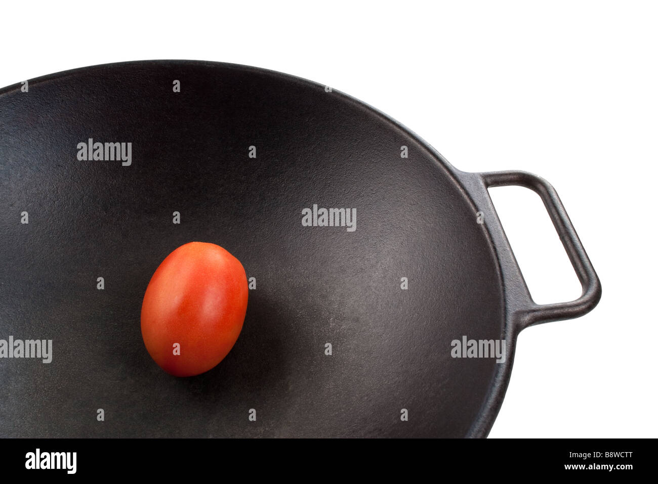 Roma tomato in wok Stock Photo - Alamy