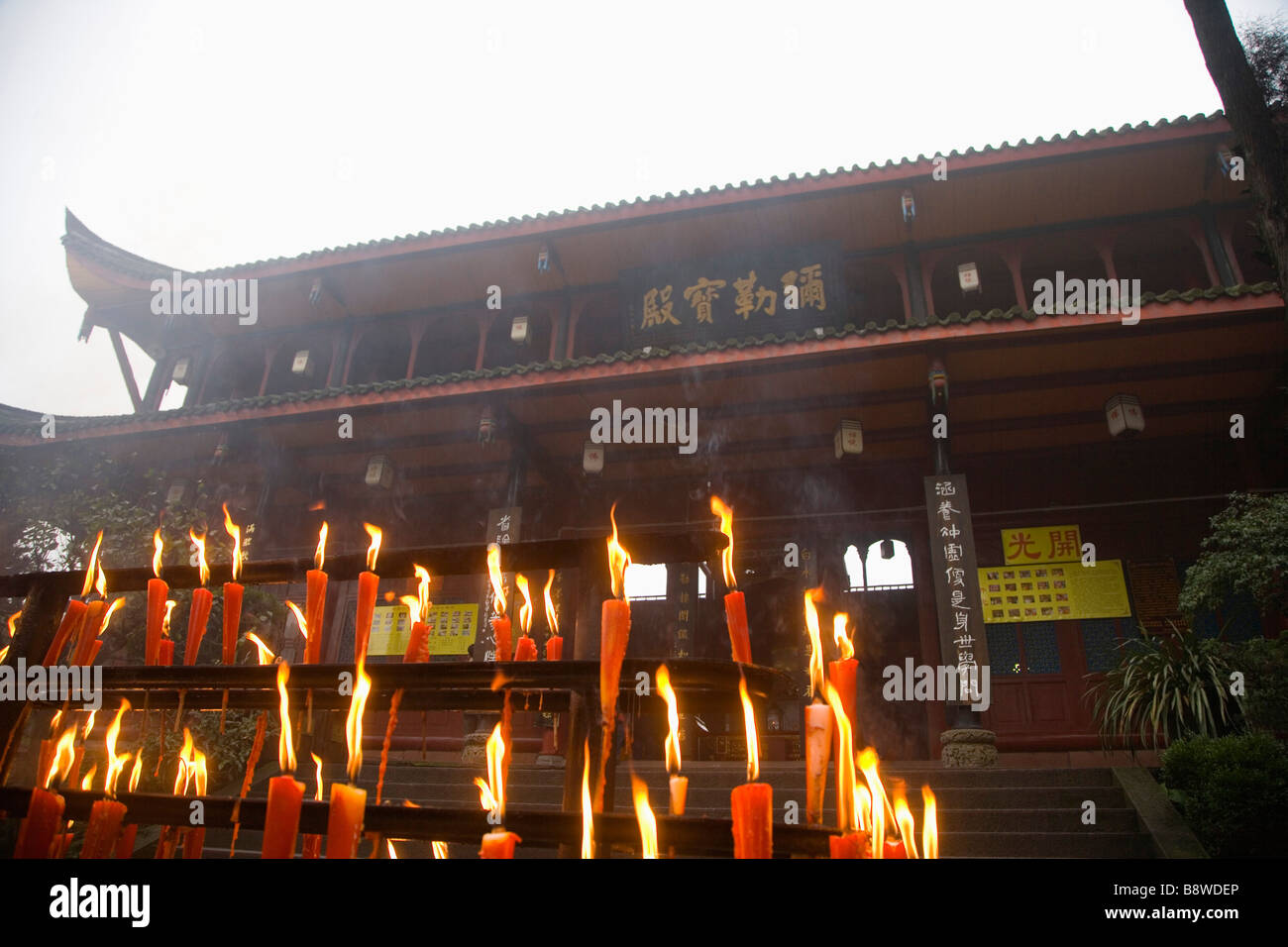China Sichuan Province Mt Emei Wannian Temple lit candles Stock Photo