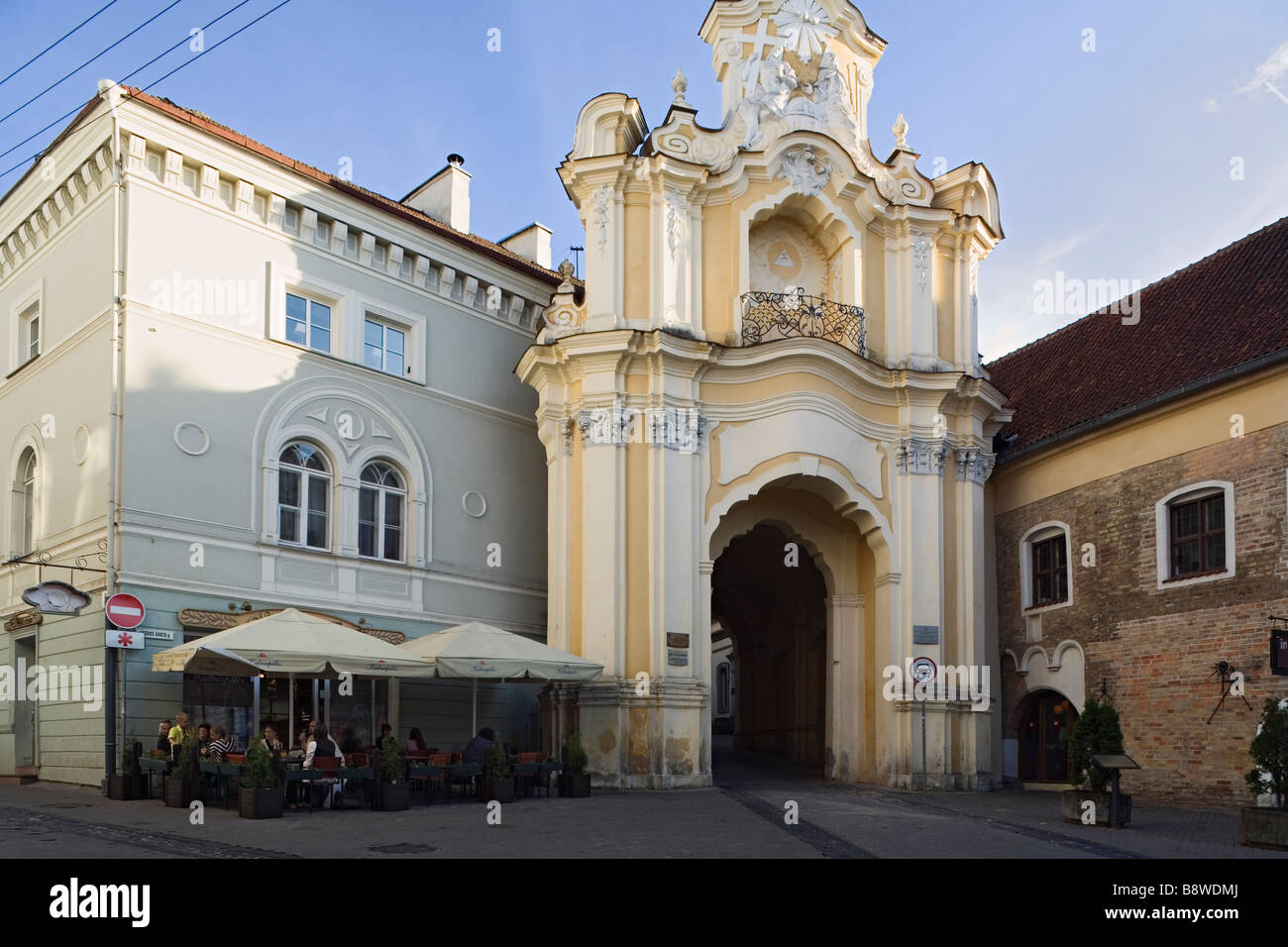 Vilnius, Lithuania, Europe. Basilian Gate and cafe restaurant in the old town Stock Photo