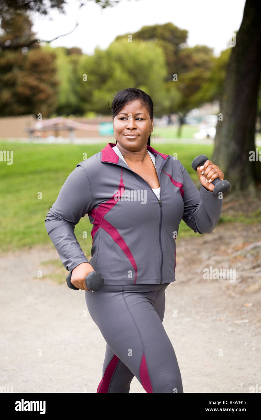 Plus size model walking with weights Stock Photo Alamy