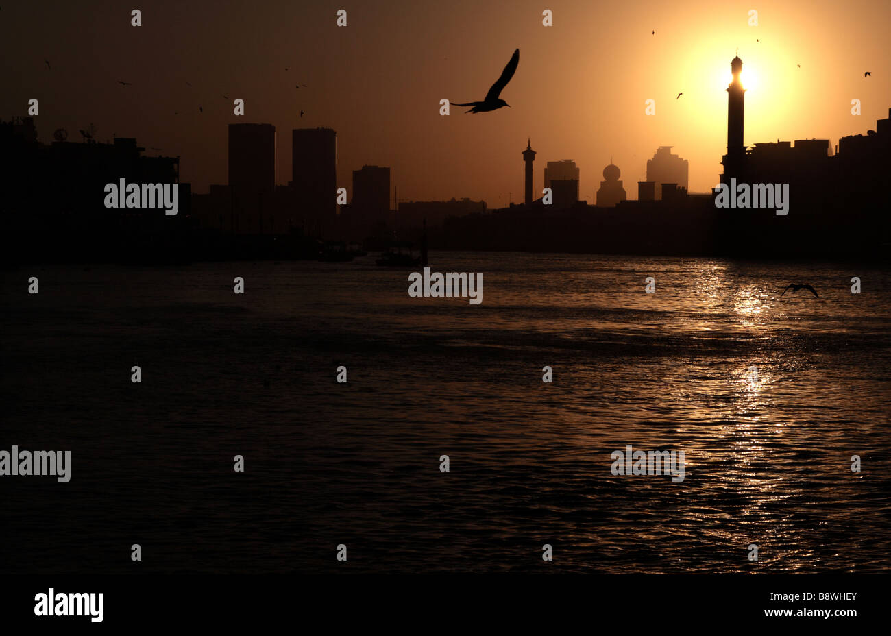 Call to Prayer - Dubai, Sunrise behind the Grand Mosque, Sandstorm coming. Stock Photo