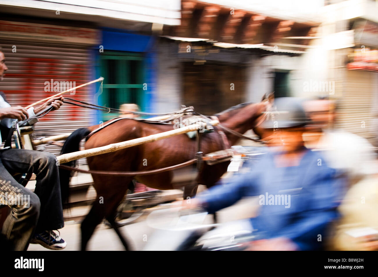 Daily scenes in the streets of India. slow shutter speed and panning for motion blur. Stock Photo