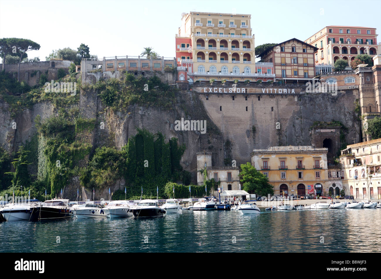 The back of the exclusive hotel 'Excelsior Vittoria' in Sorrento Italy with the boats in the lower harbor Stock Photo