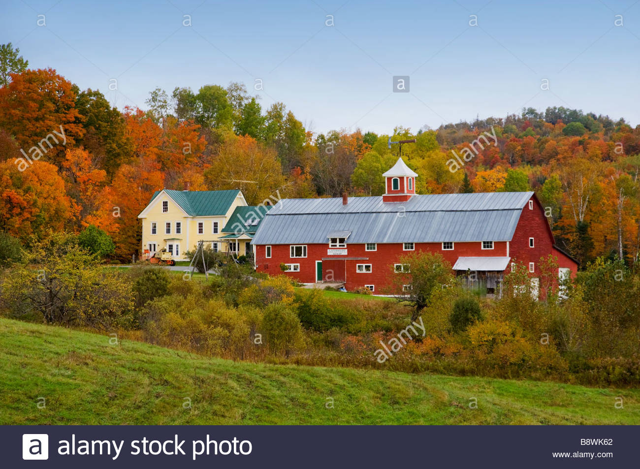 Fall foliage and farm with red barn in rural Vermont USA Stock Photo