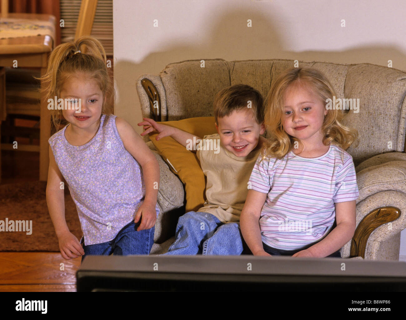 Children watching TV Stock Photo
