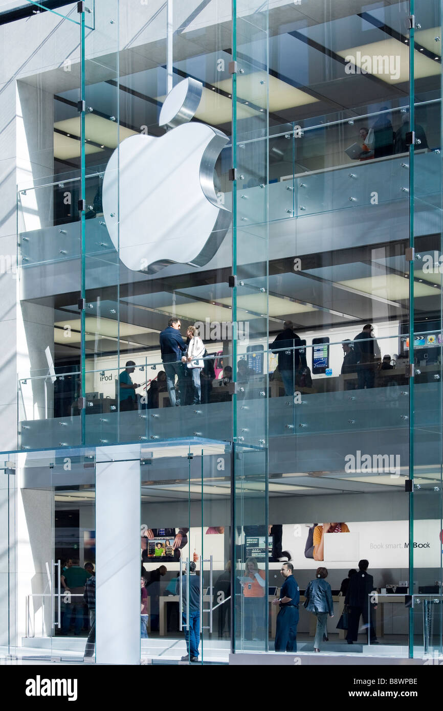 People shopping at the Sydney Apple Store. Sydney NSW Australia. The largest Apple Logo of the world. Stock Photo
