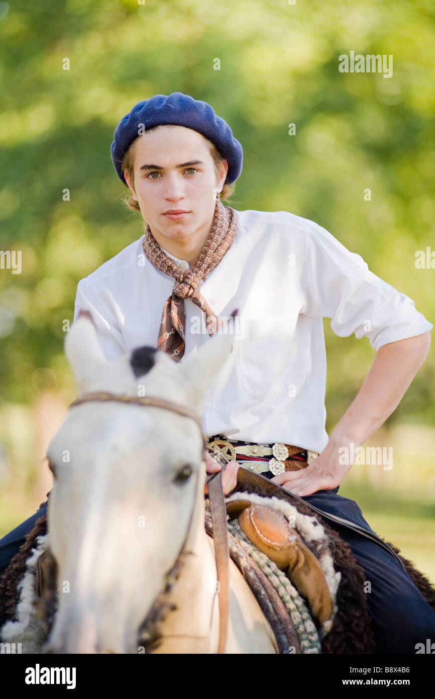 Young Gaucho riding a horse - Argentina Stock Photo