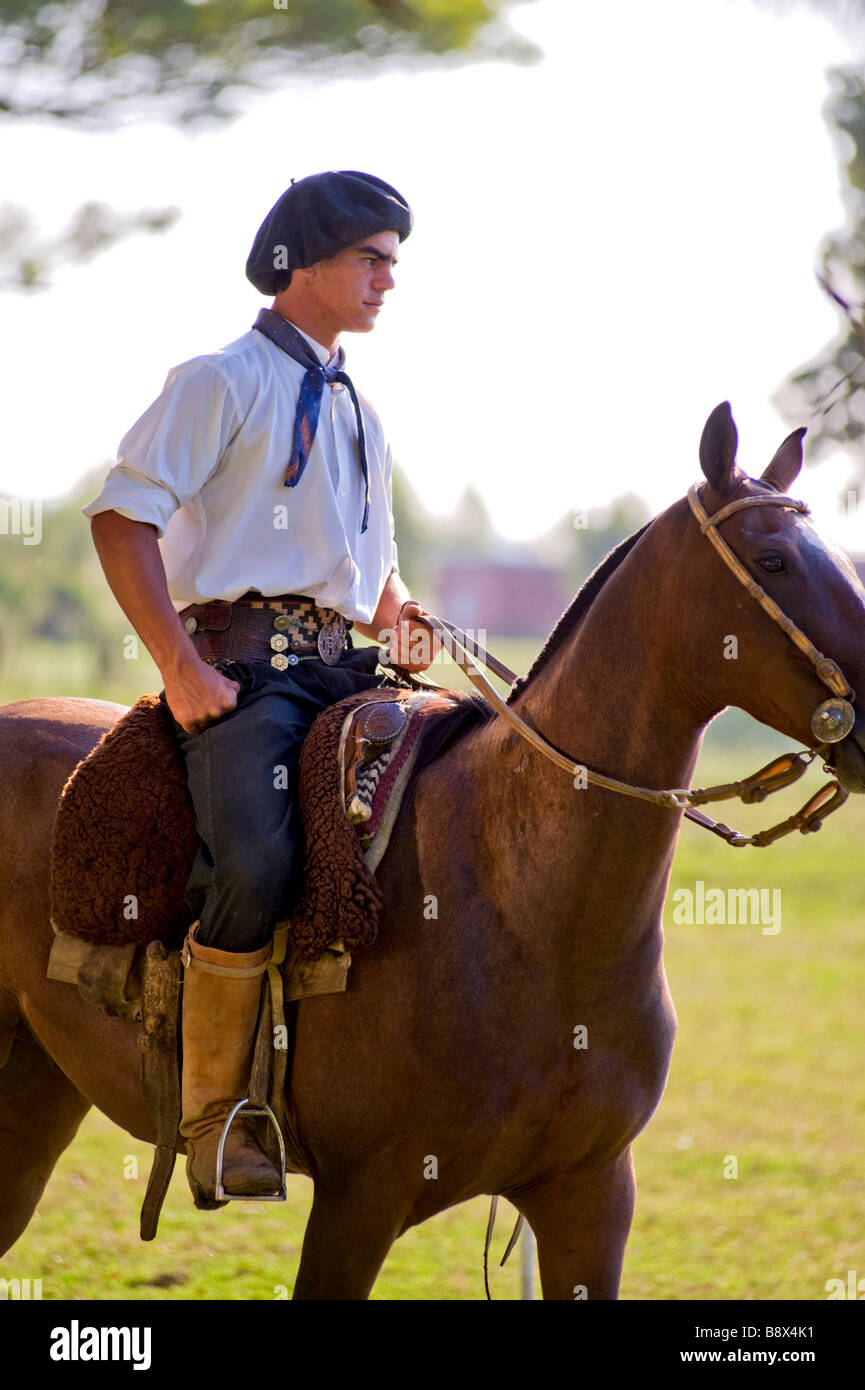 Young Gaucho riding a horse - Argentina Stock Photo