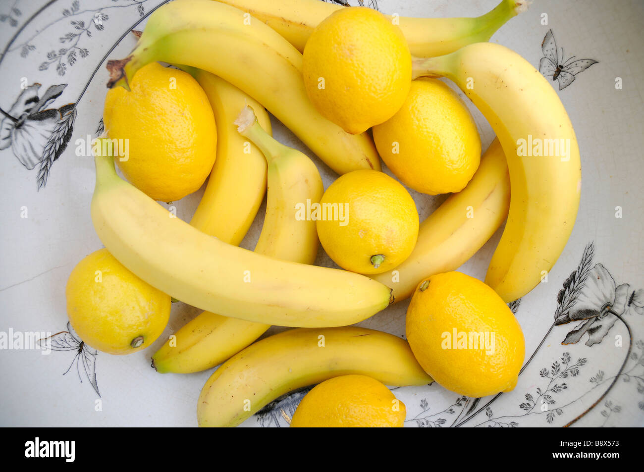bananas and lemons in a bowl Stock Photo Alamy