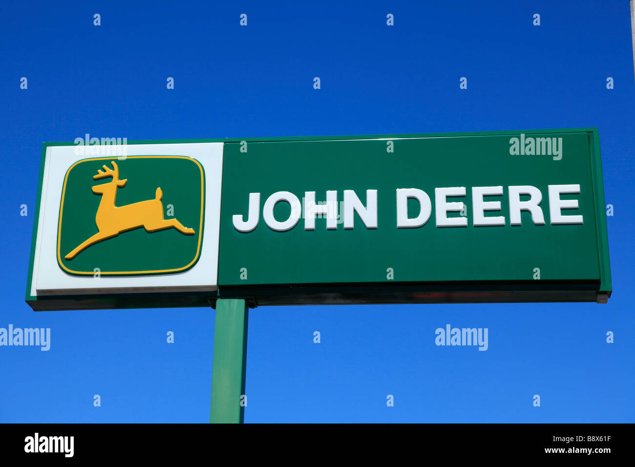 John Deere Logo Sign On A Retail Storefront Stock Photo - Download