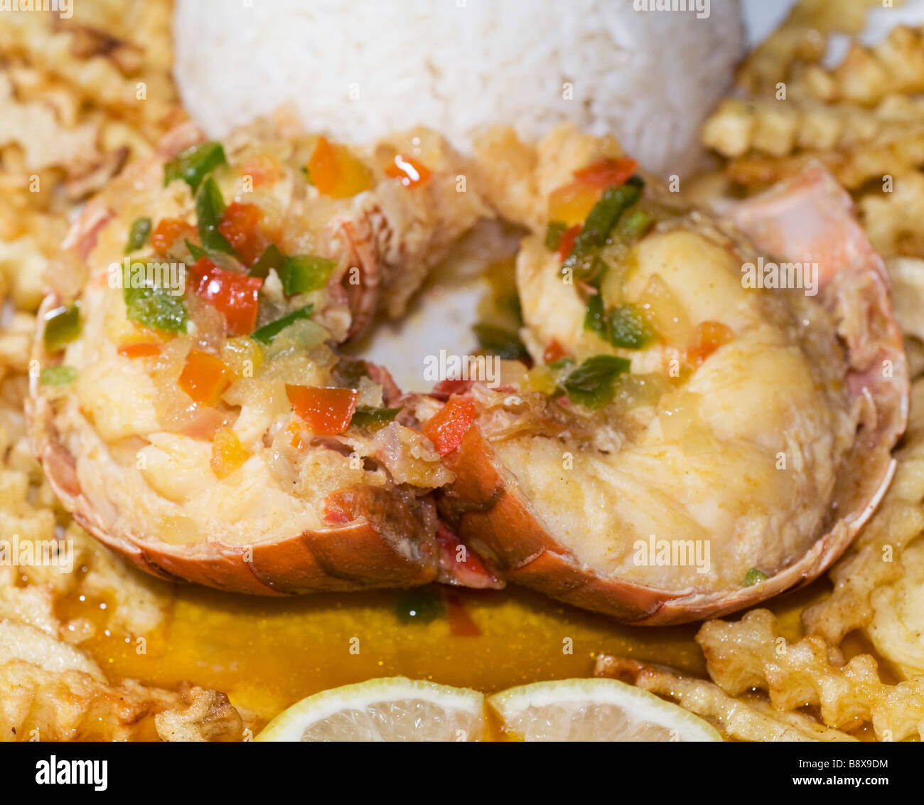 caribbean lobster tail dinner with rice french fried potatoes and