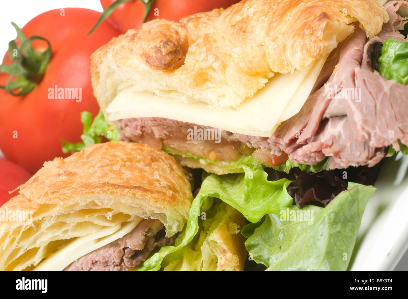 roast beef sandwich with swiss cheese on croissant french bread Stock