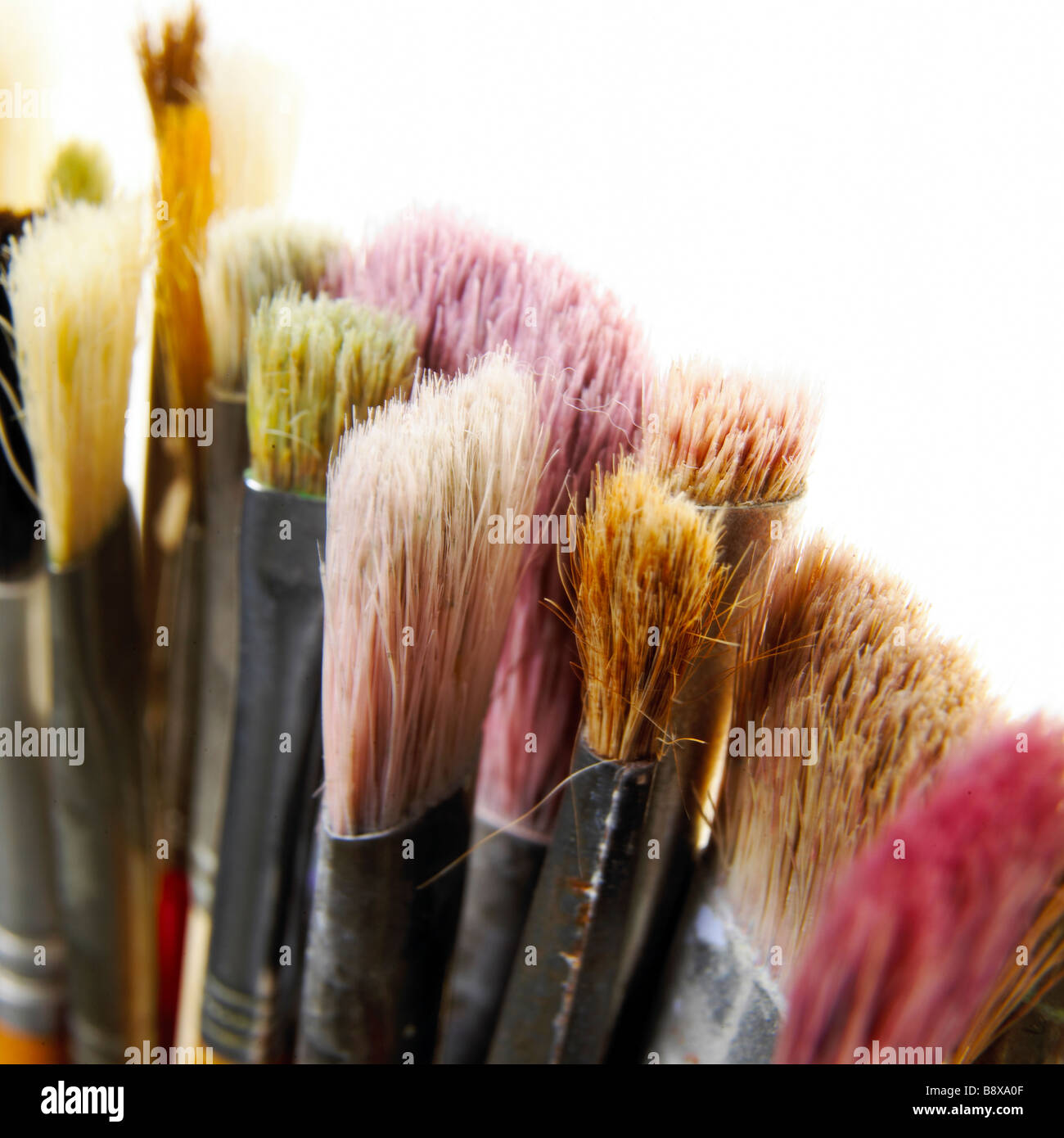 A group of used paint brushes Stock Photo