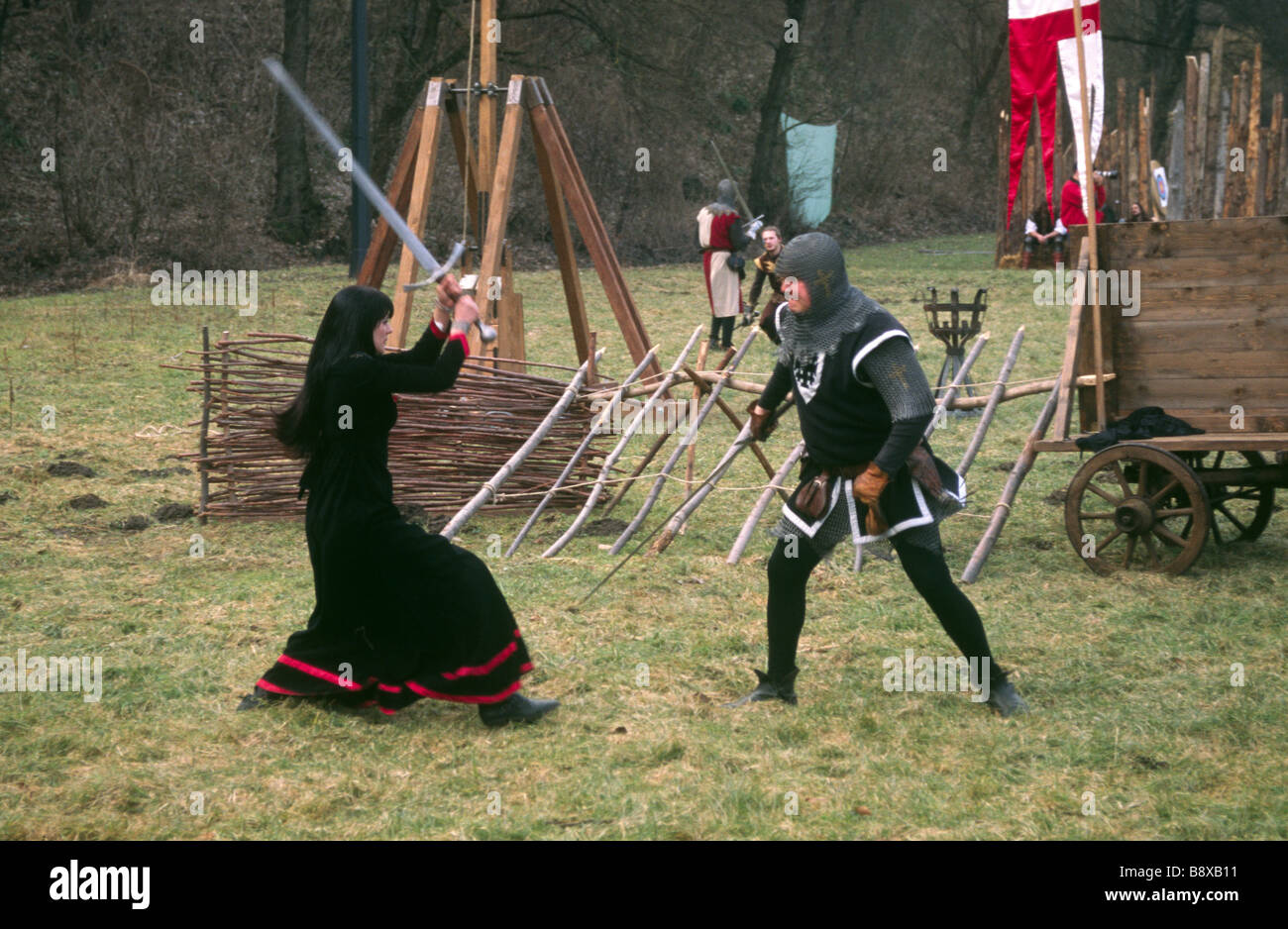 Woman and man in fencing battle Stock Photo Alamy