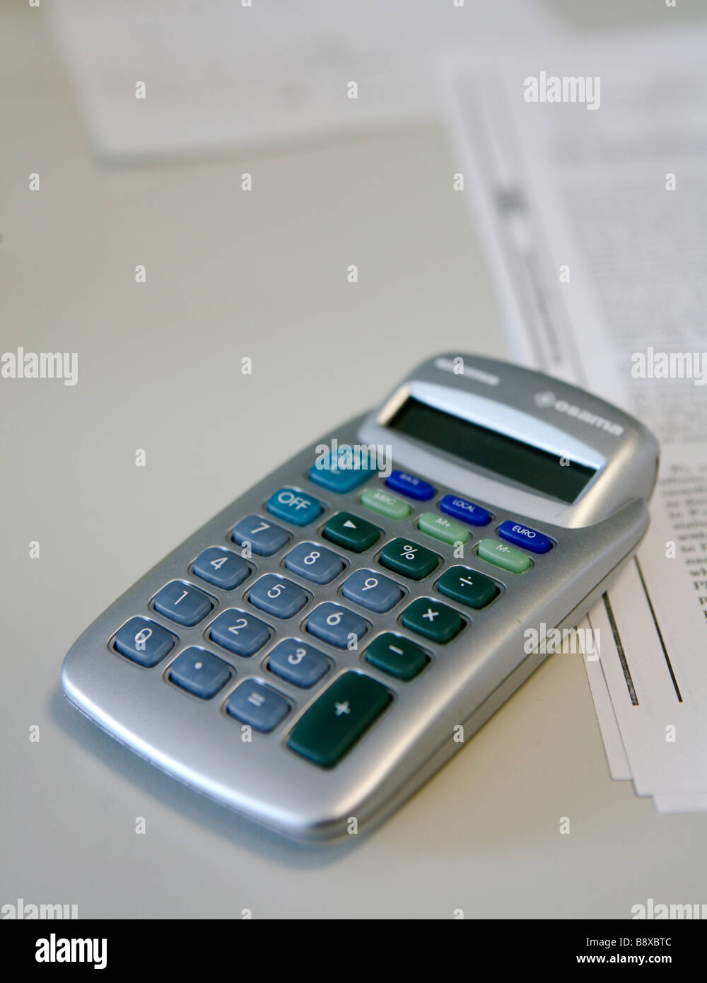 calculator and sheet of paper Stock Photo